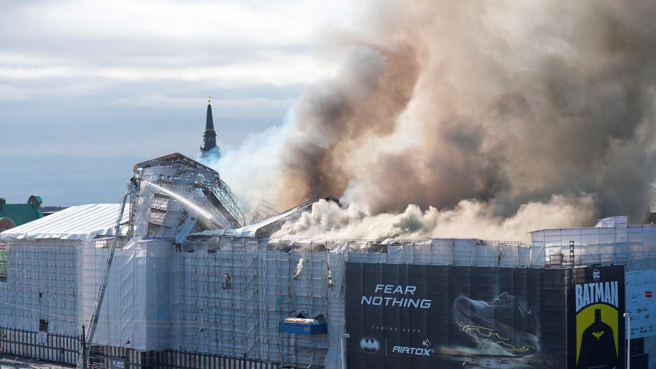 Smoke billows following a fire at the Old Stock Exchange, Boersen, in Copenhagen