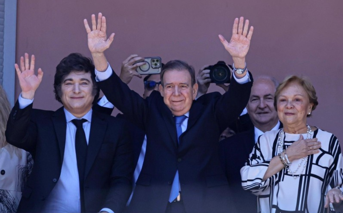 Javier Milei (L), Edmundo Gonzalez Urrutia, self-proclaimed 'president-elect' of Venezuela, (C), and his wife Mercedes Lopez (R) appear on the Casa Rosada balcony