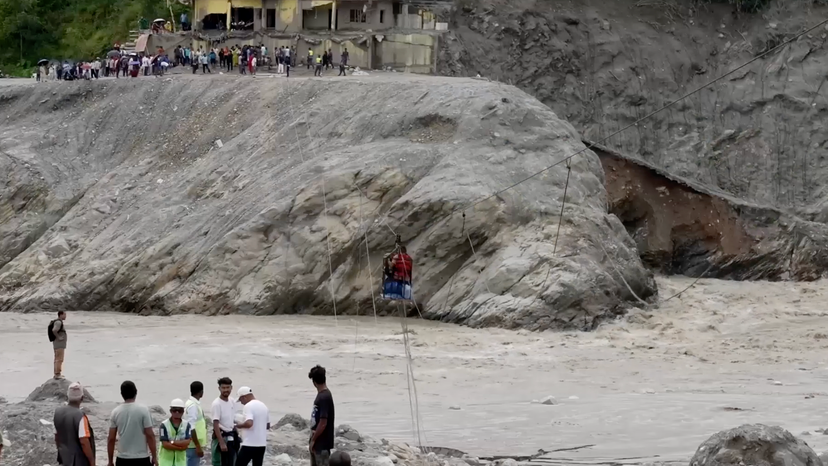 Nepalis cross river with zipline