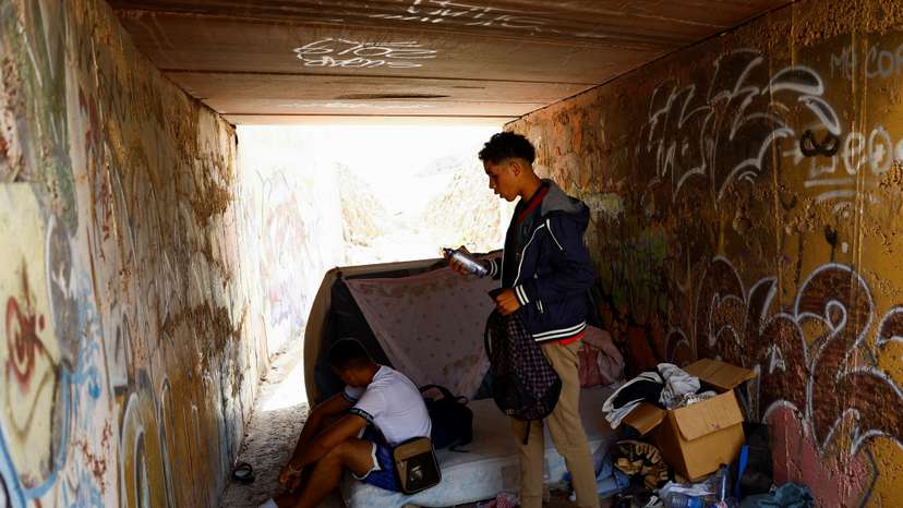 Moroccan migrants live in a ravine in Arinaga