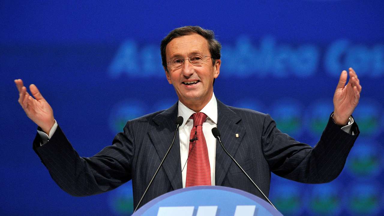 FILE PHOTO: Gianfranco Fini gestures as he delivers his speech at the first meeting of his new political party 'Futuro e Liberta' in Milan