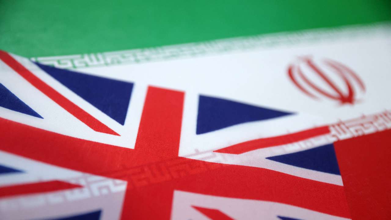 Illustration shows UK and Iran flags
