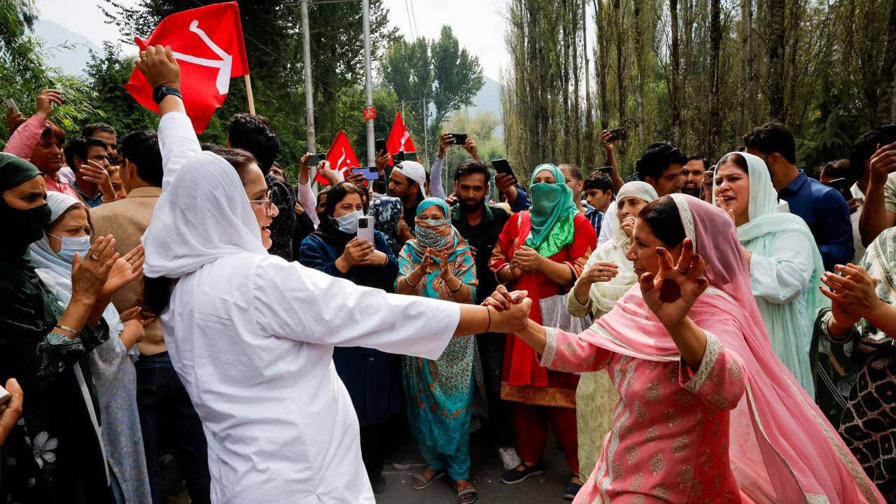 FILE PHOTO: Supporters of the Jammu and Kashmir National Conference party celebrate outside the vote counting centre on the day of the assembly election results, in Srinagar