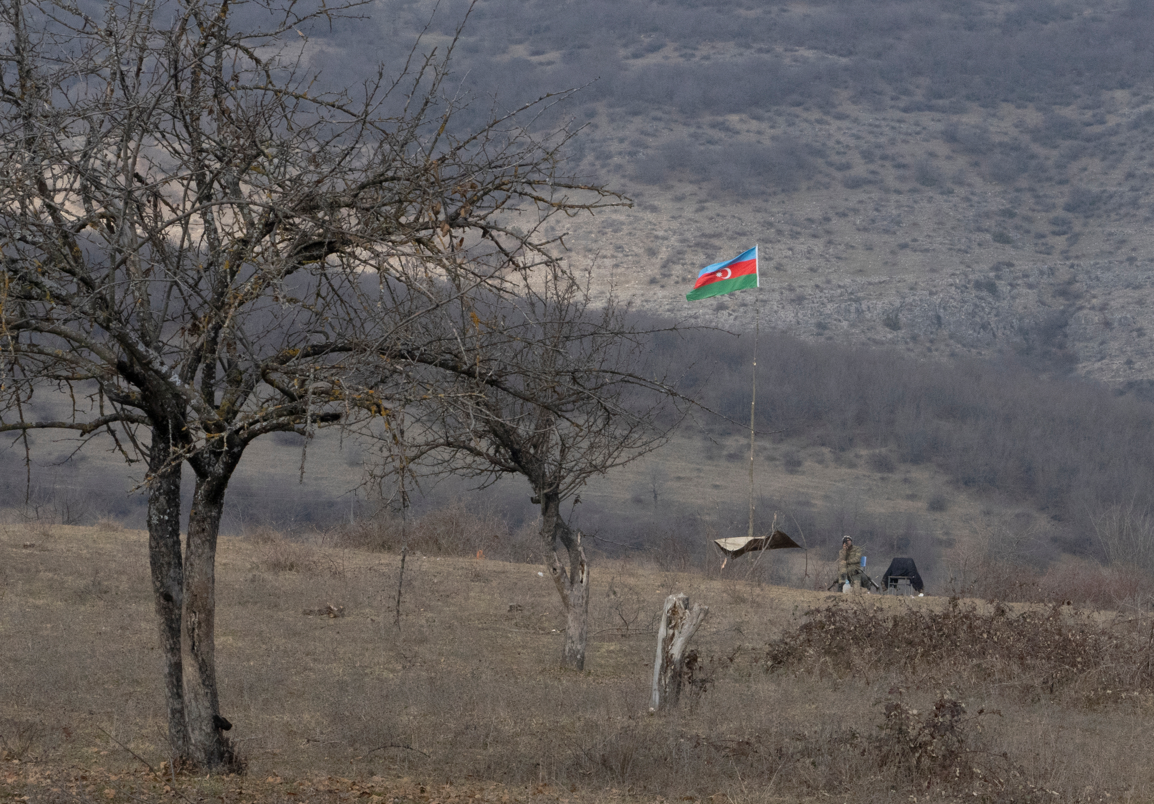 An Azeri soldier is seen at fighting positions near divided Taghavard village in Nagorno-Karabakh region