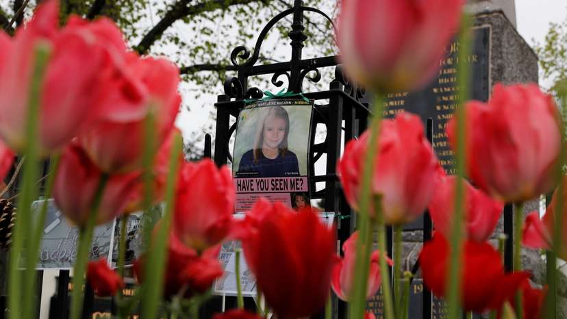 An age progression image of Madeleine McCann hangs on a war memorial on the 11th anniversary of her disappearance from a holiday flat in Portugal, near her home in Rothley