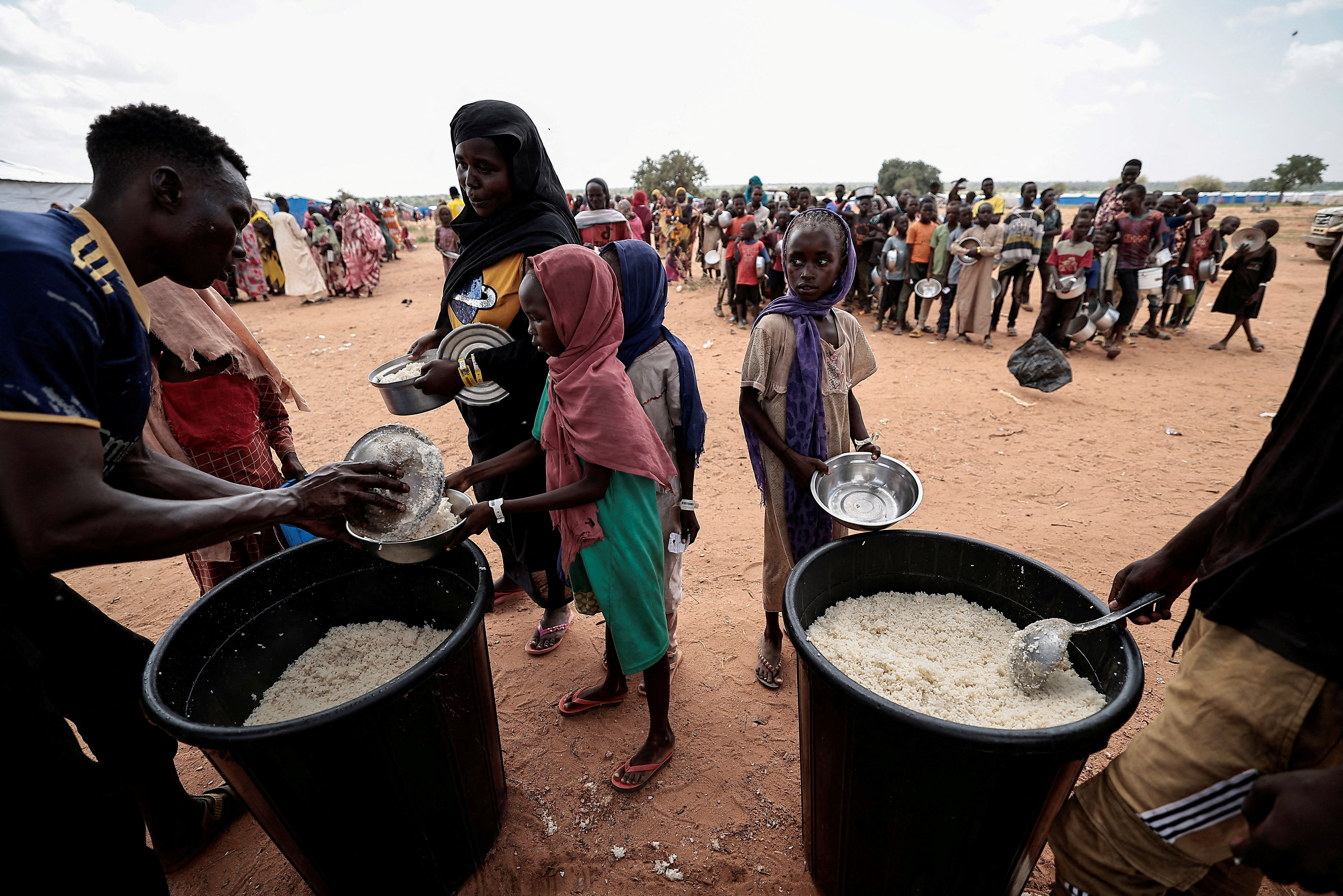 FILE PHOTO: Red Cross volunteers help Sudanese people who fled to Chad
