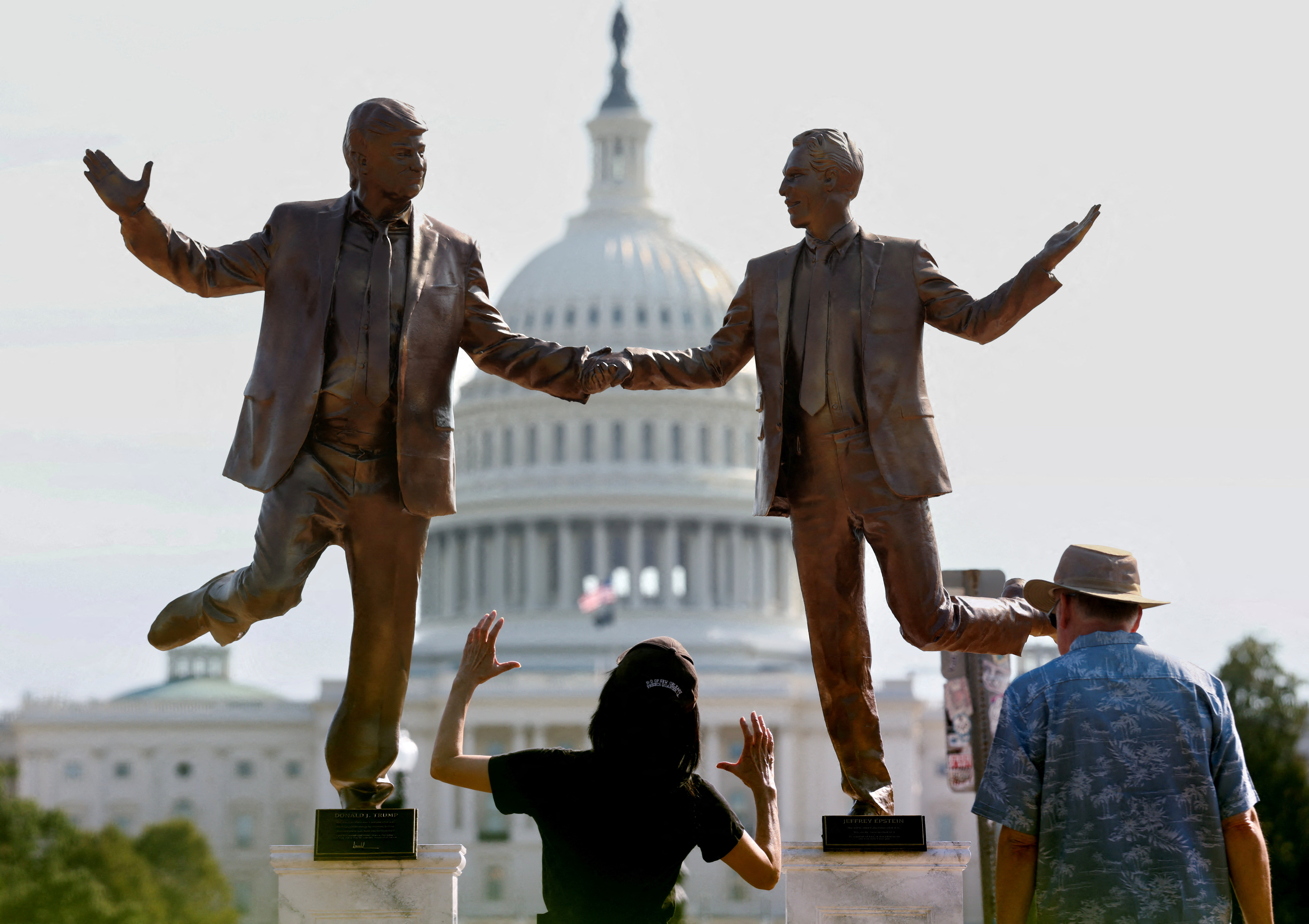 FILE PHOTO: Pop-up statue of Trump and Epstein in Washington