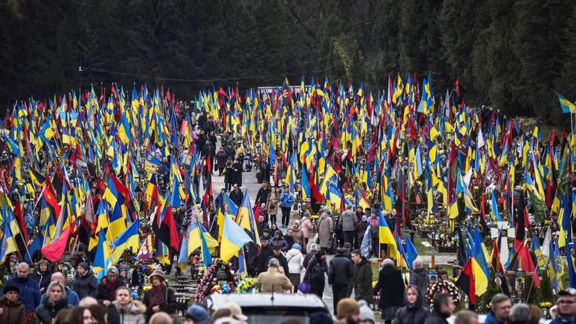 People visit graves of killed Ukrainian defenders, on the day of the second anniversary of Russia's attack on Ukraine, in Lviv