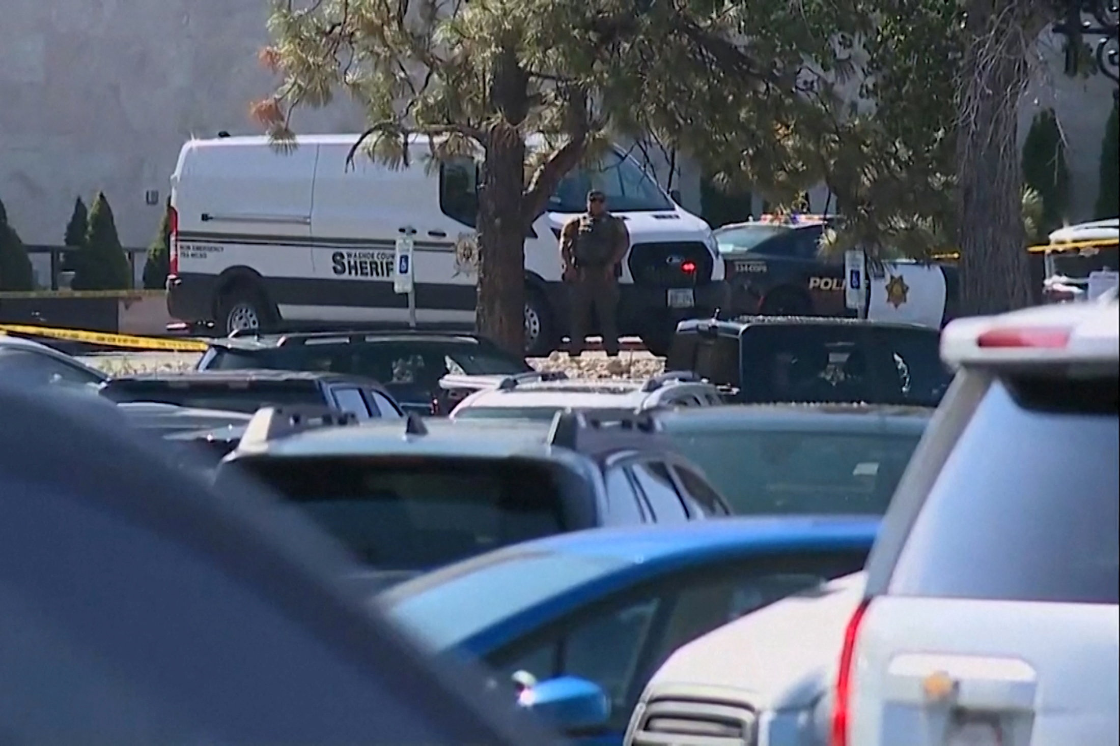 A Washoe County Sheriff's Deputy keeps watch outside the Grand Sierra Resort casino after a fatal shooting in Reno
