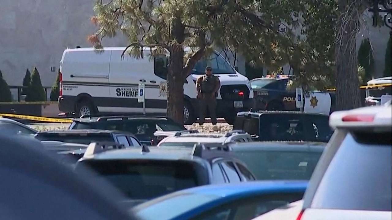 A Washoe County Sheriff's Deputy keeps watch outside the Grand Sierra Resort casino after a fatal shooting in Reno
