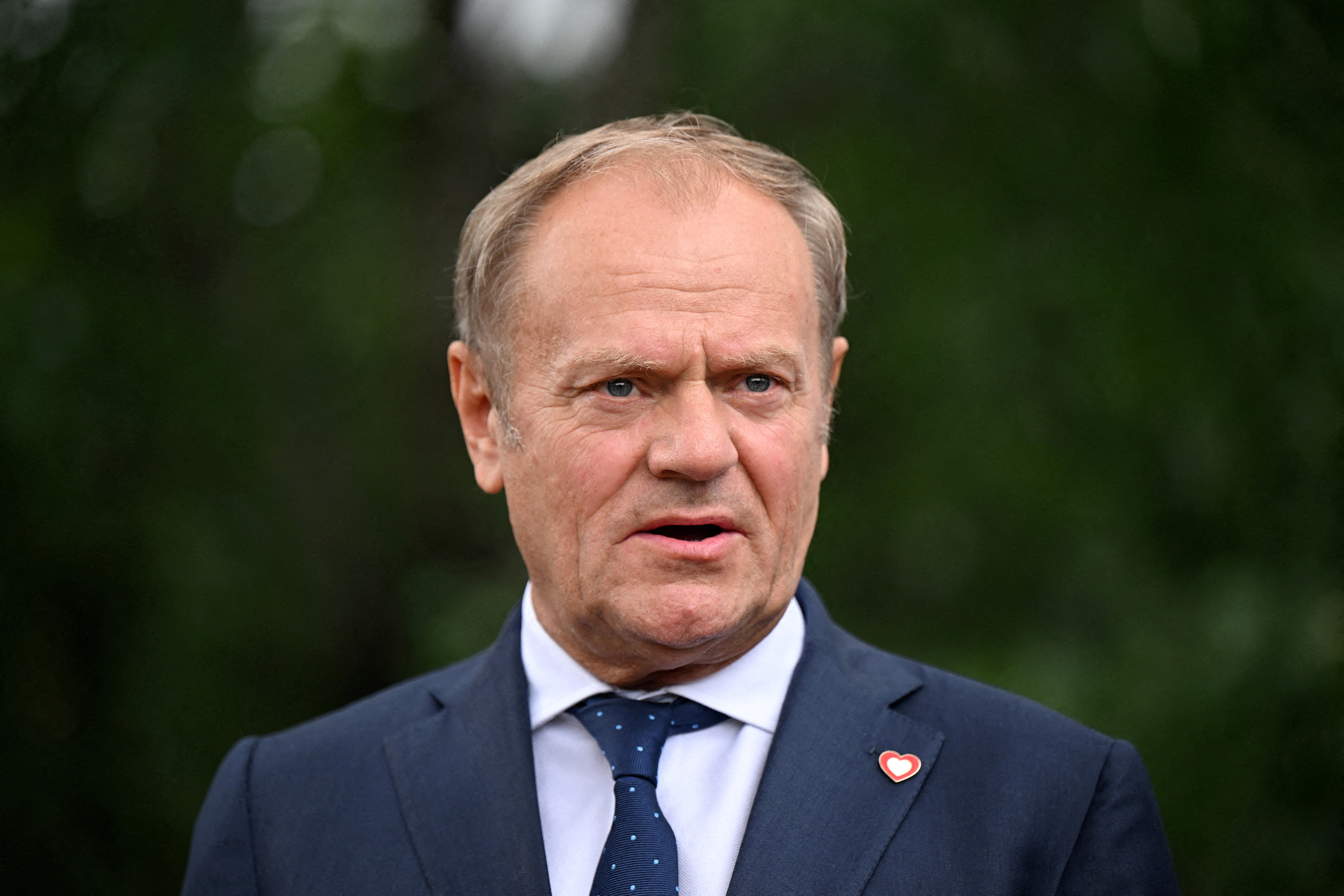 FILE PHOTO: Poland's Prime Minister Donald Tusk talks to the press in Tirana