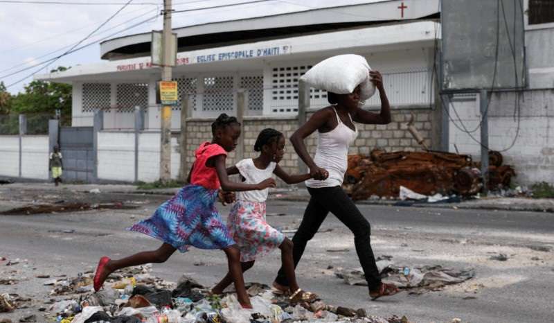Residents flee homes due to gang violence, in Port-au-Prince