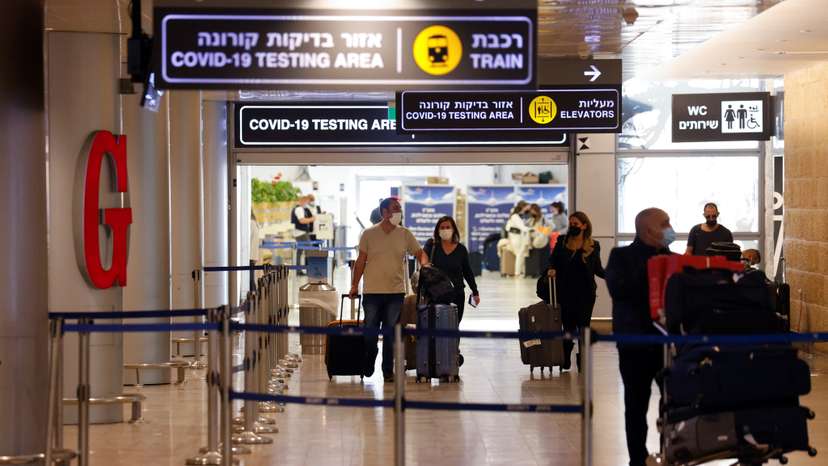 Travellers exit the coronavirus disease (COVID-19) pandemic testing area at Ben Gurion International Airport as Israel imposes new restrictions