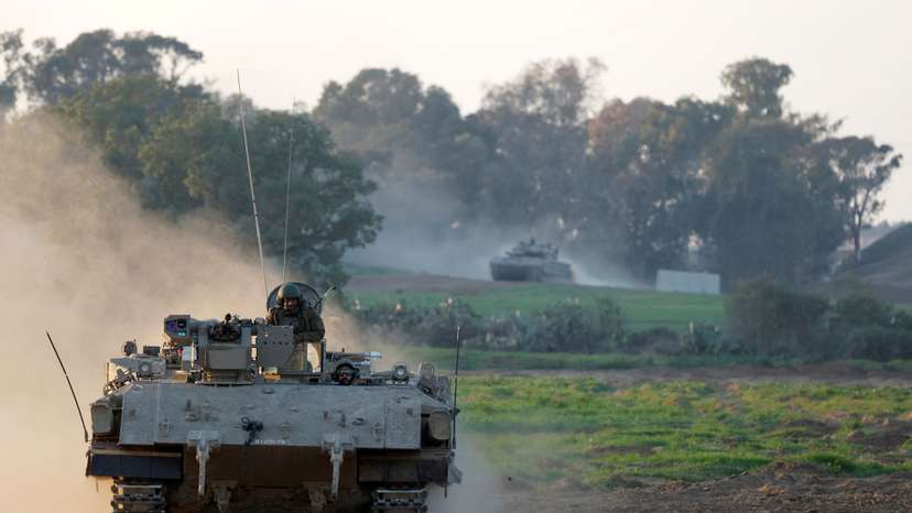 An Israeli APC enters Israel from Gaza, at the Israel-Gaza border