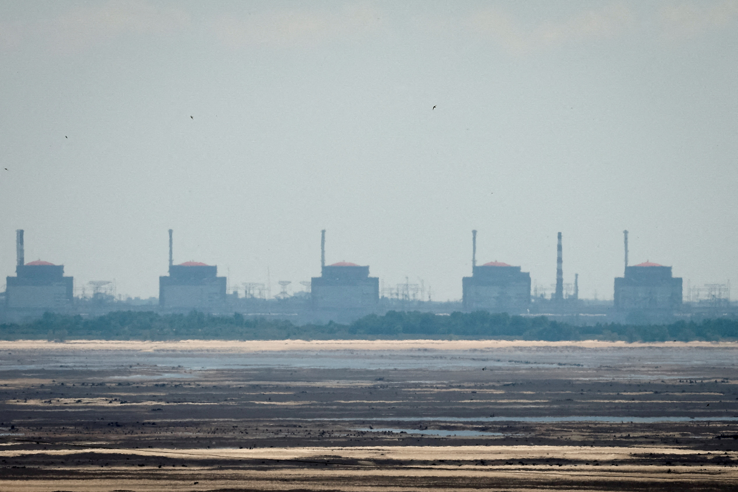 FILE PHOTO: FILE PHOTO: View shows Zaporizhzhia Nuclear Power Plant from the bank of Kakhovka Reservoir in Nikopol