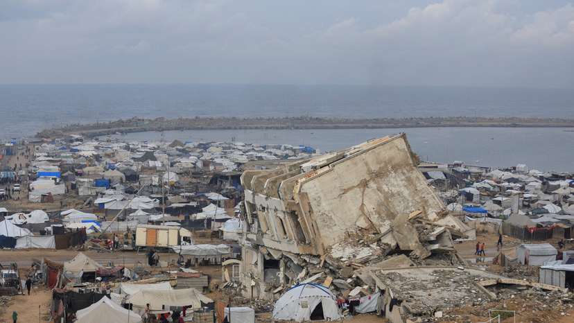 Palestinians shelter in tents during rain in Gaza City