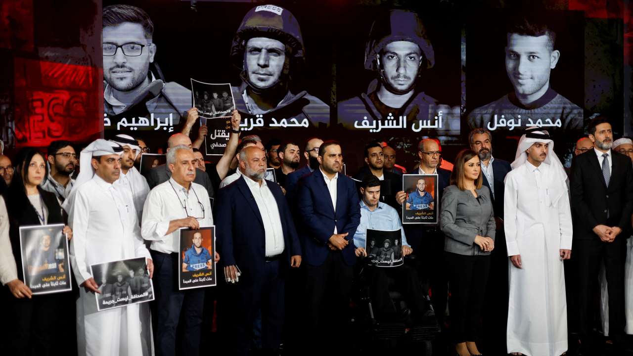 Al Jazeera staff members gather at the network’s studios to remember their colleagues killed in Gaza City by an Israeli strike, in Doha