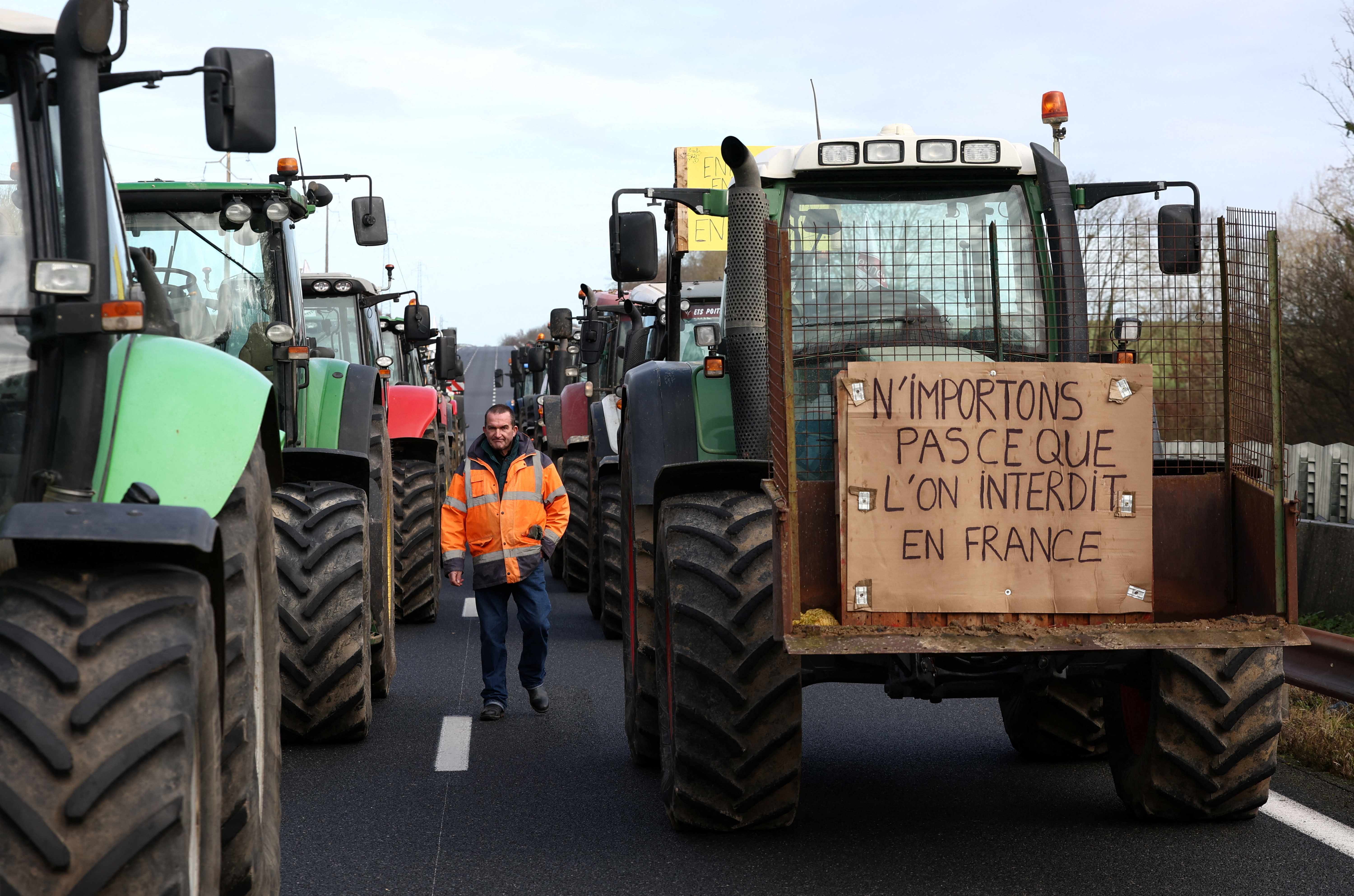 French farmer Regis Bomy walks during protest in Chamant