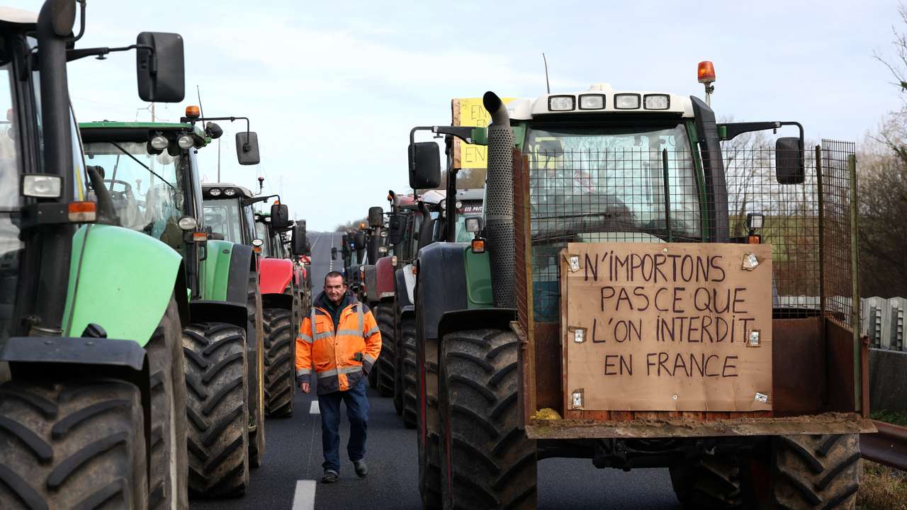 French farmer Regis Bomy walks during protest in Chamant