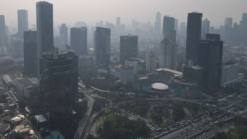 General view of high-rise buildings shrouded in smog in Jakarta