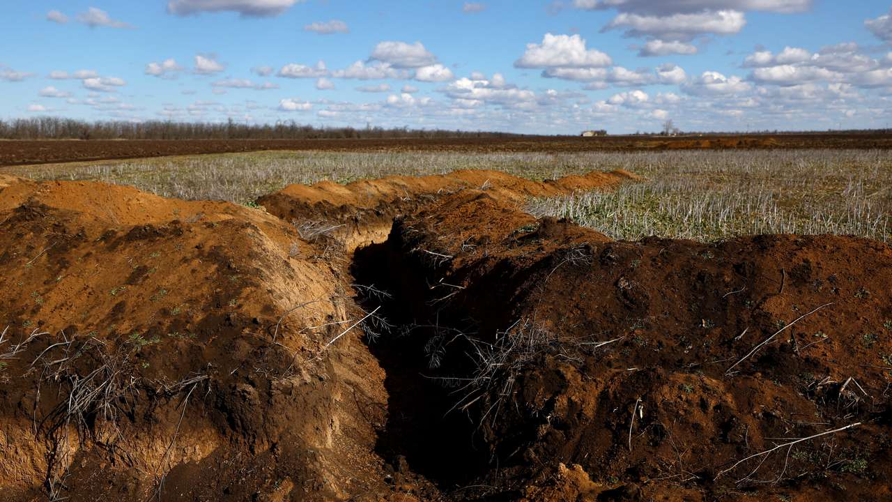 FILE PHOTO: Ukraine's farmers sow bitter crop into mined fields