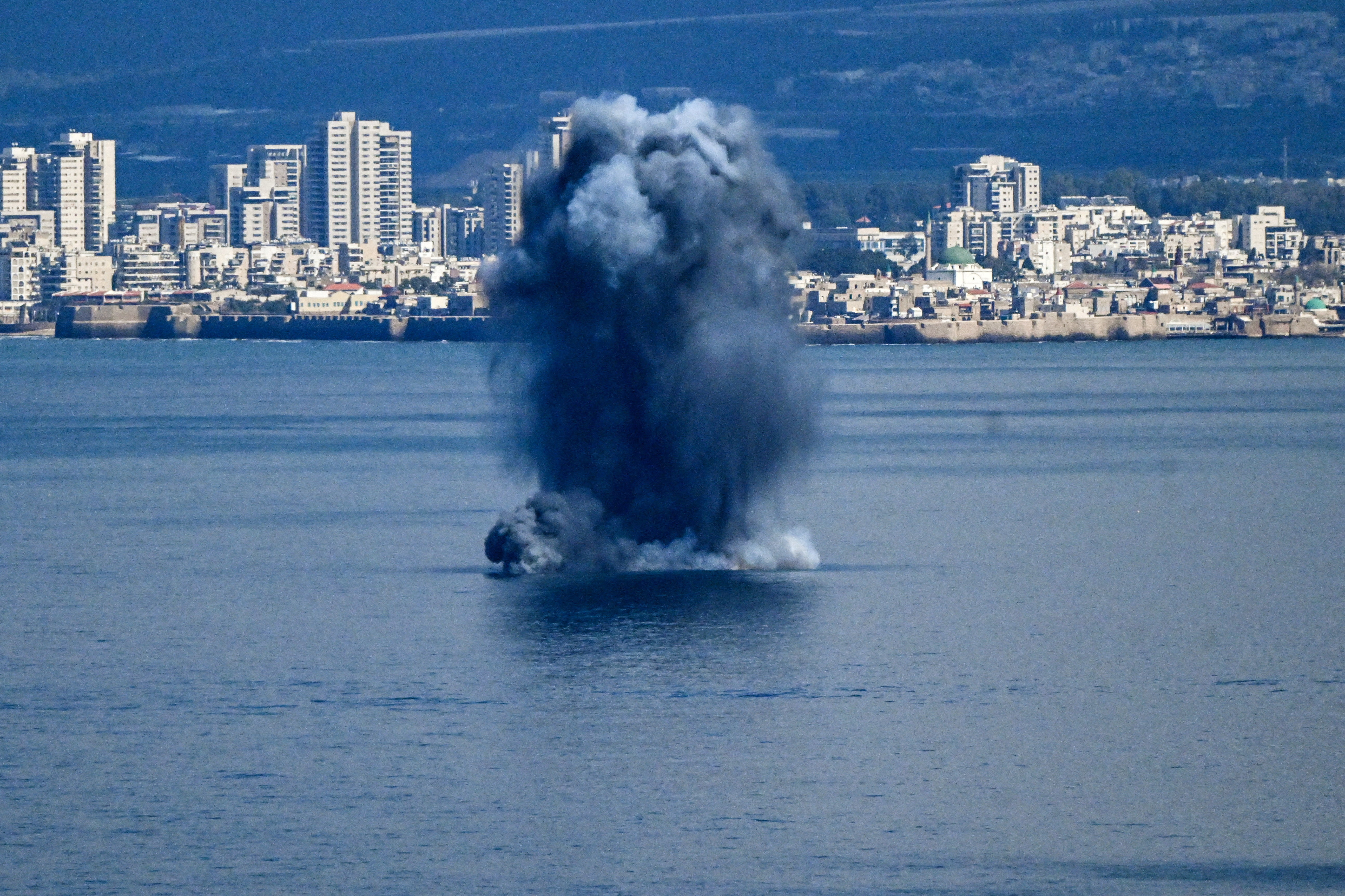 Explosion in the sea after missiles were launched towards Israel from Iran, as seen from Haifa