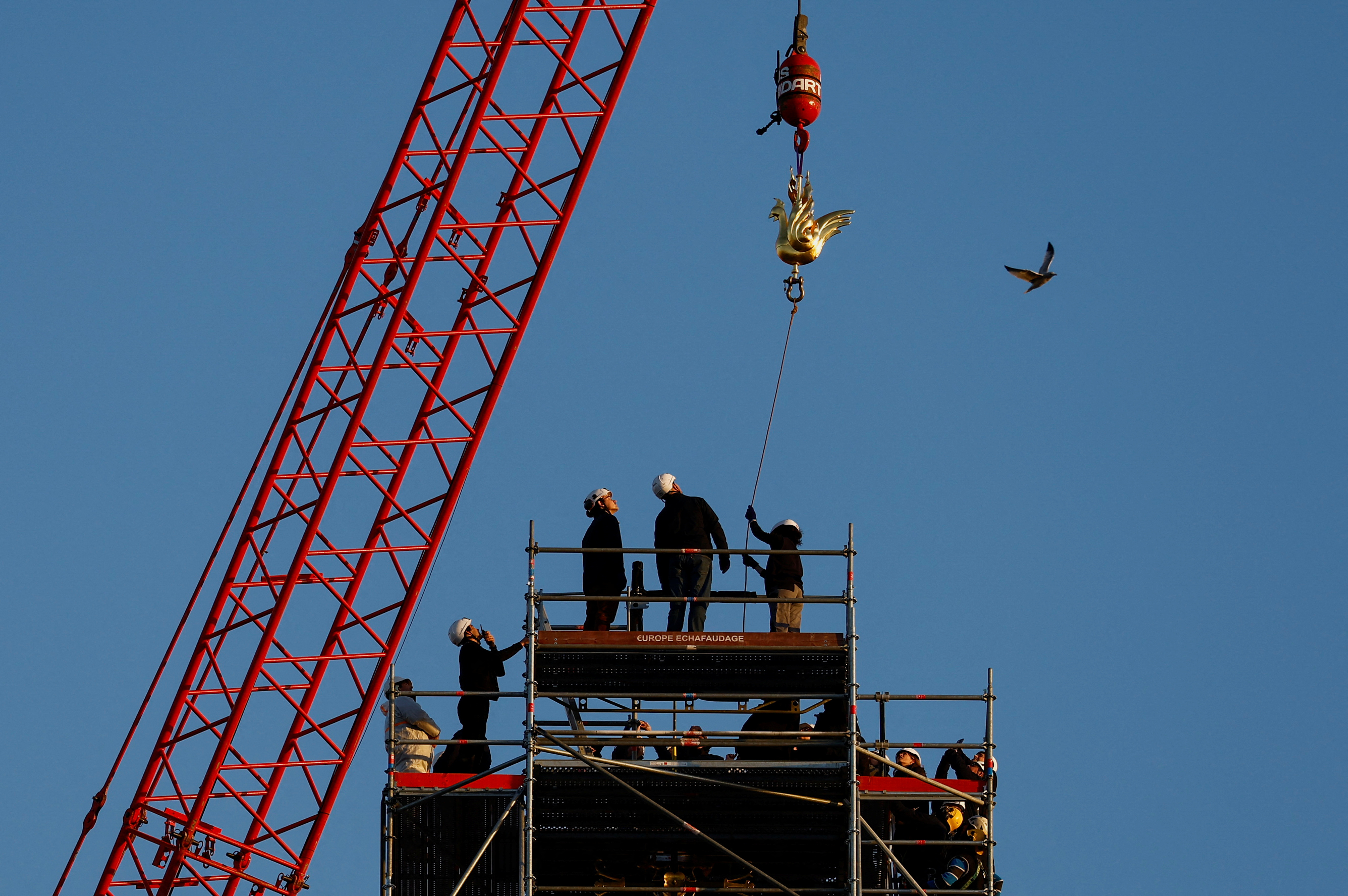A new rooster is prepared to be installed at the top of the spire of the Notre-Dame de Paris Cathedral