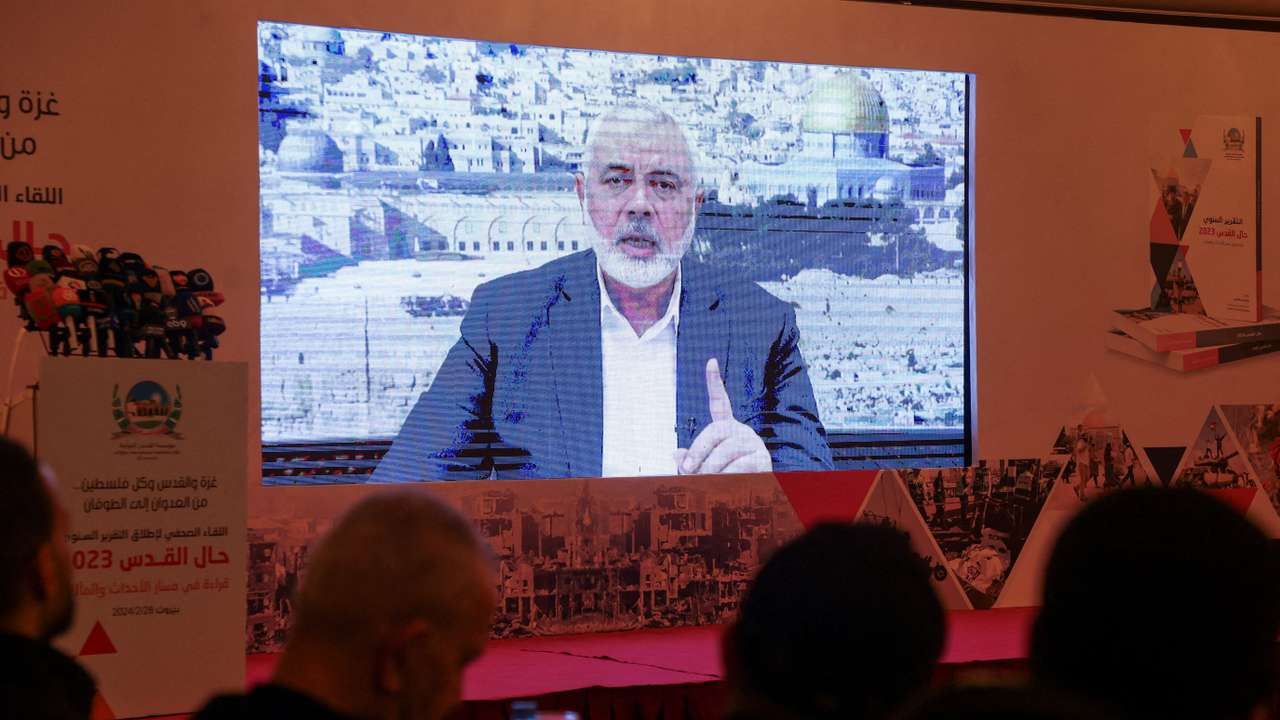 FILE PHOTO: Hamas leader, Ismail Haniyeh, speaks in a pre-recorded message shown on a screen during a press event for Al Quds International Institution in Beirut