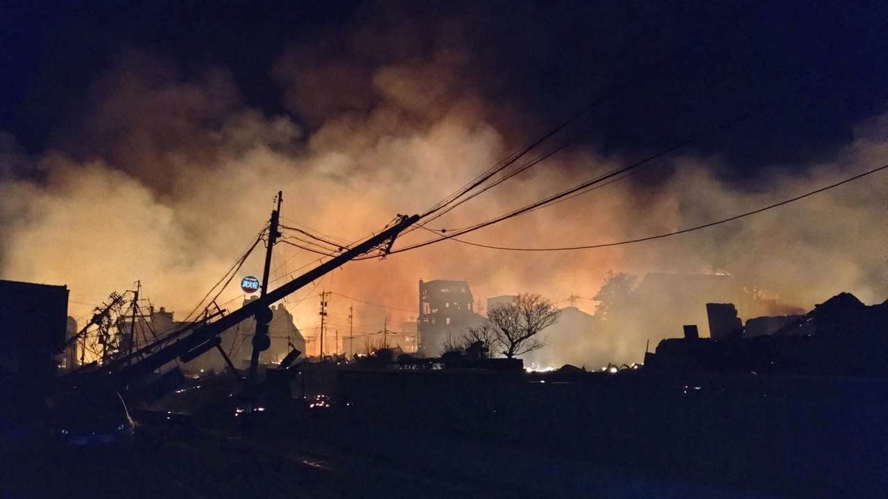 Fire burns following an earthquake at a residential area in Wajima