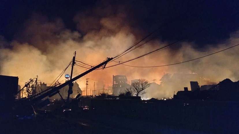 Fire burns following an earthquake at a residential area in Wajima