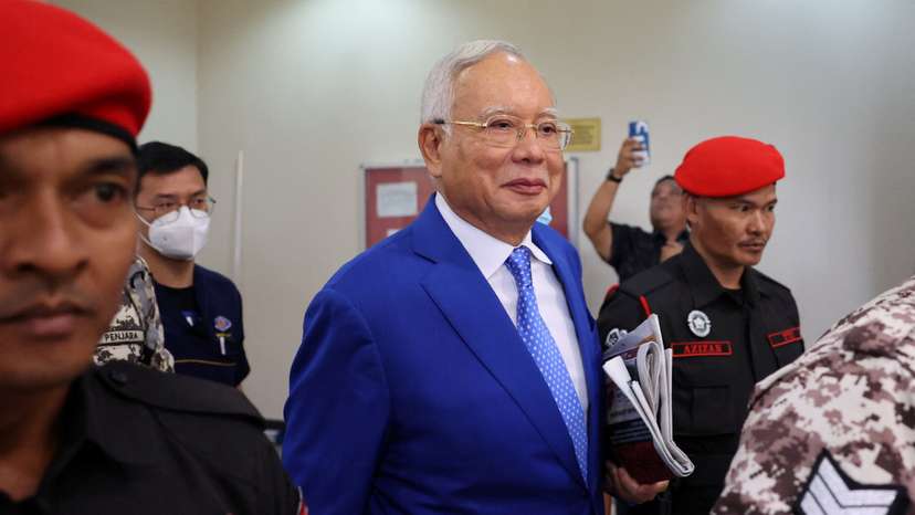 Former Malaysian Prime Minister Najib Razak escorted by prison officers as the jailed politician left the court after court proceedings in Kuala Lumpur