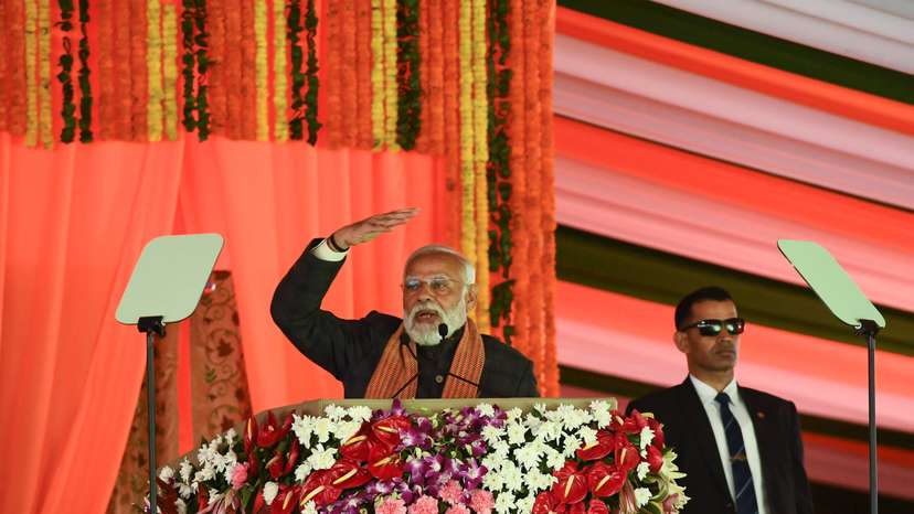 India’s Prime Minister Narendra Modi speaks during a rally, as his bodyguard looks on at the Bakshi Stadium in Srinagar