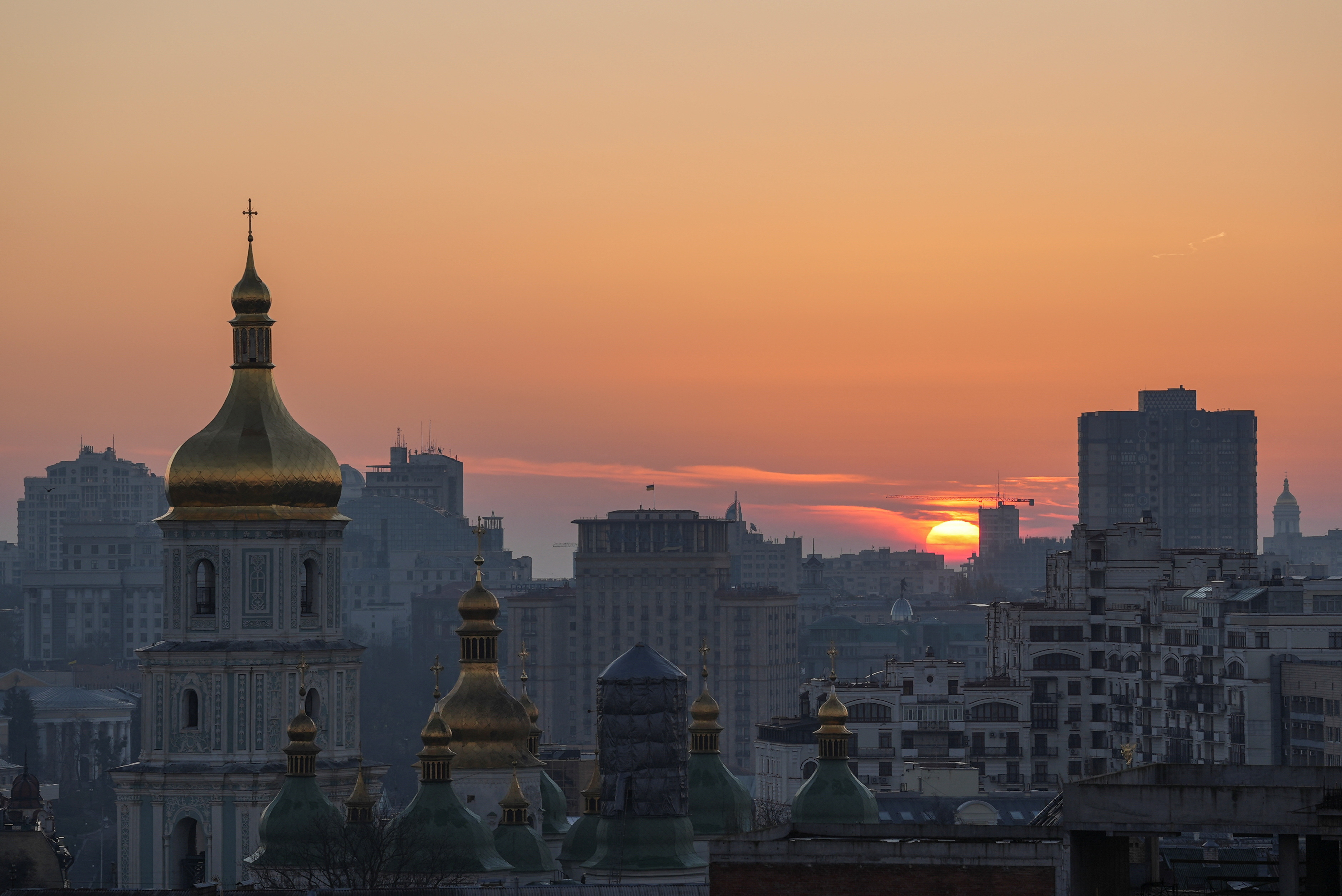 Sun rises over Ukraine's capital during a massive Russian missile and drone strike in Kyiv