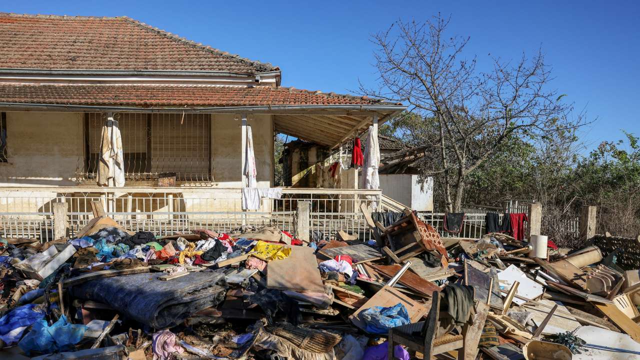 FILE PHOTO: Clothes, furniture and other belongings of locals are pictured piled up outside a house, in the aftermath of Storm Daniel, in the village of Metamorfosi