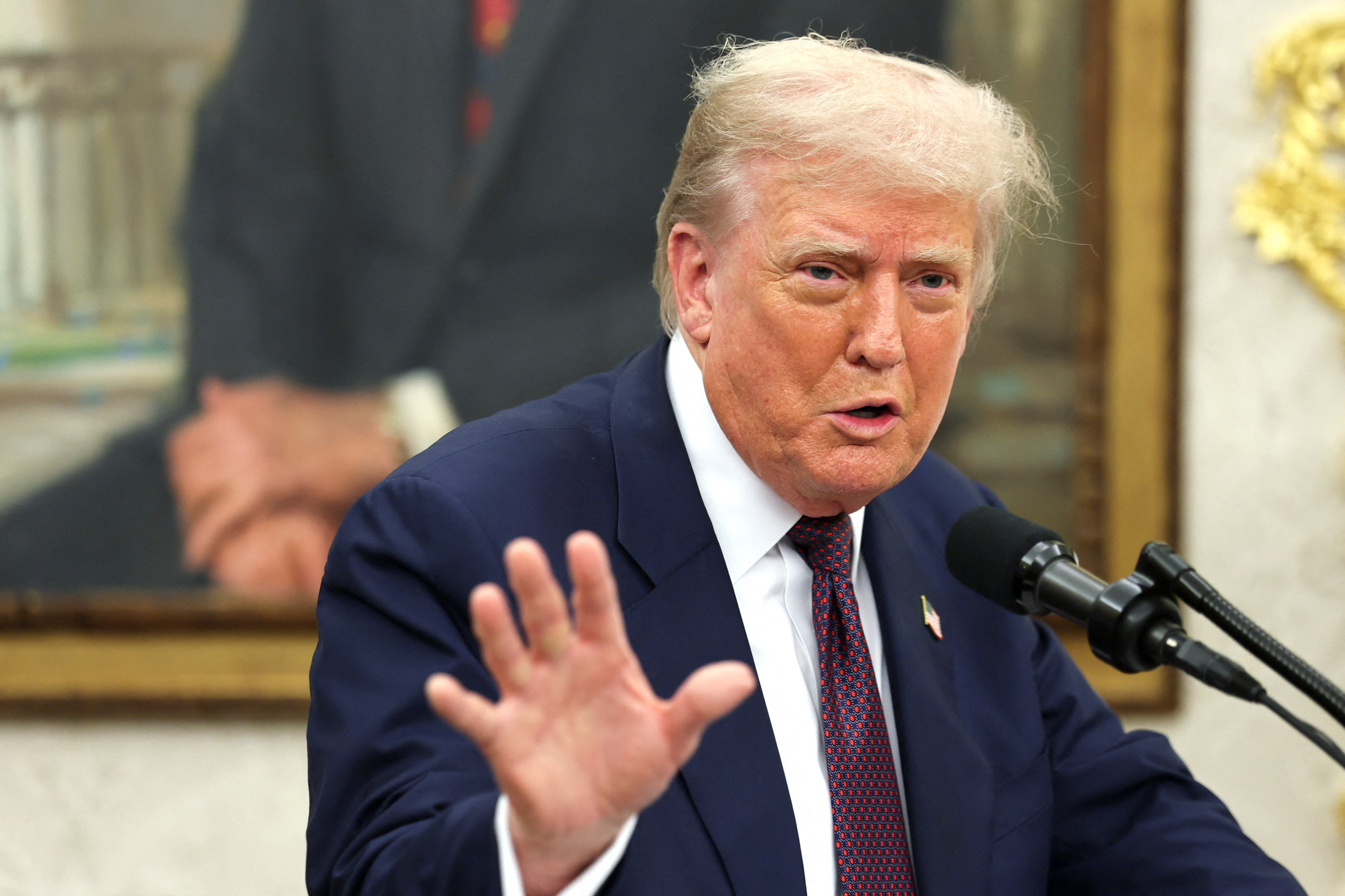 U.S. President Trump and Apple CEO Cook announce Apple's $100 billion investment in U.S. manufacturing, at the White House