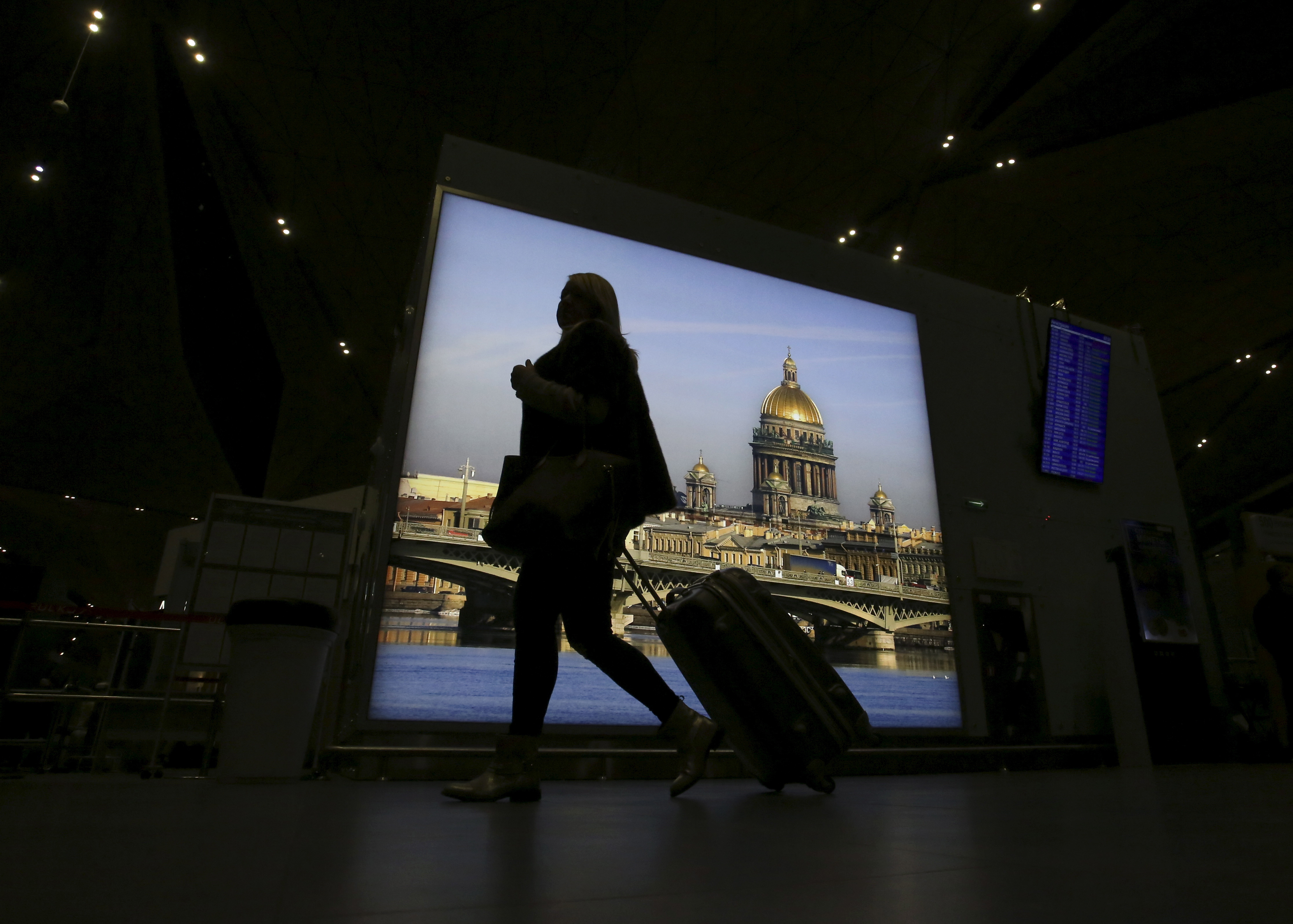 A passenger with luggage walks at Pulkovo airport outside St. Petersburg