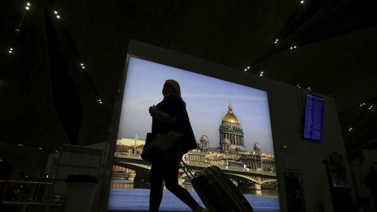 A passenger with luggage walks at Pulkovo airport outside St. Petersburg