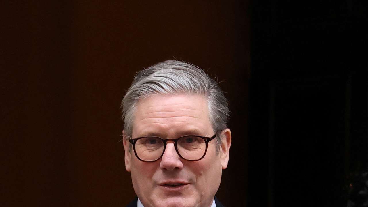 British Prime Minister Keir Starmer walks outside 10 Downing Street in London