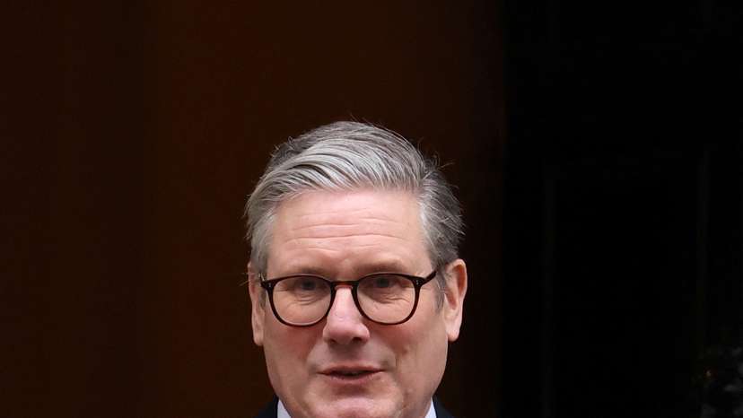 British Prime Minister Keir Starmer walks outside 10 Downing Street in London