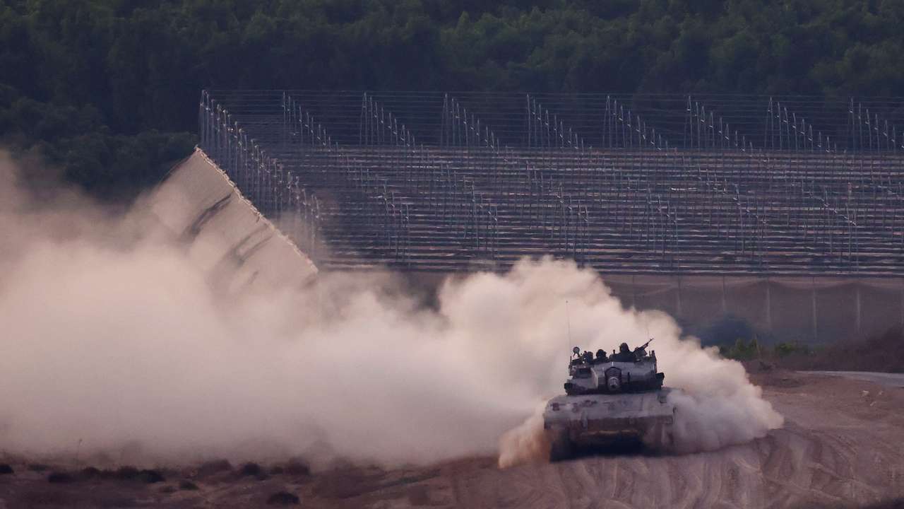 A tank manoeuvres on the Israeli side of the Israel-Gaza border