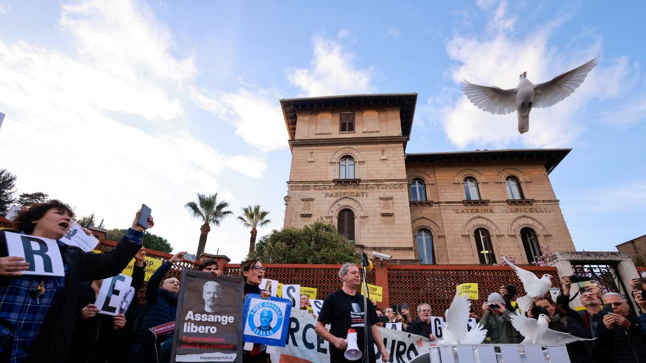 Julian Assange's supporters demonstrate in front of the British Embassy in Rome