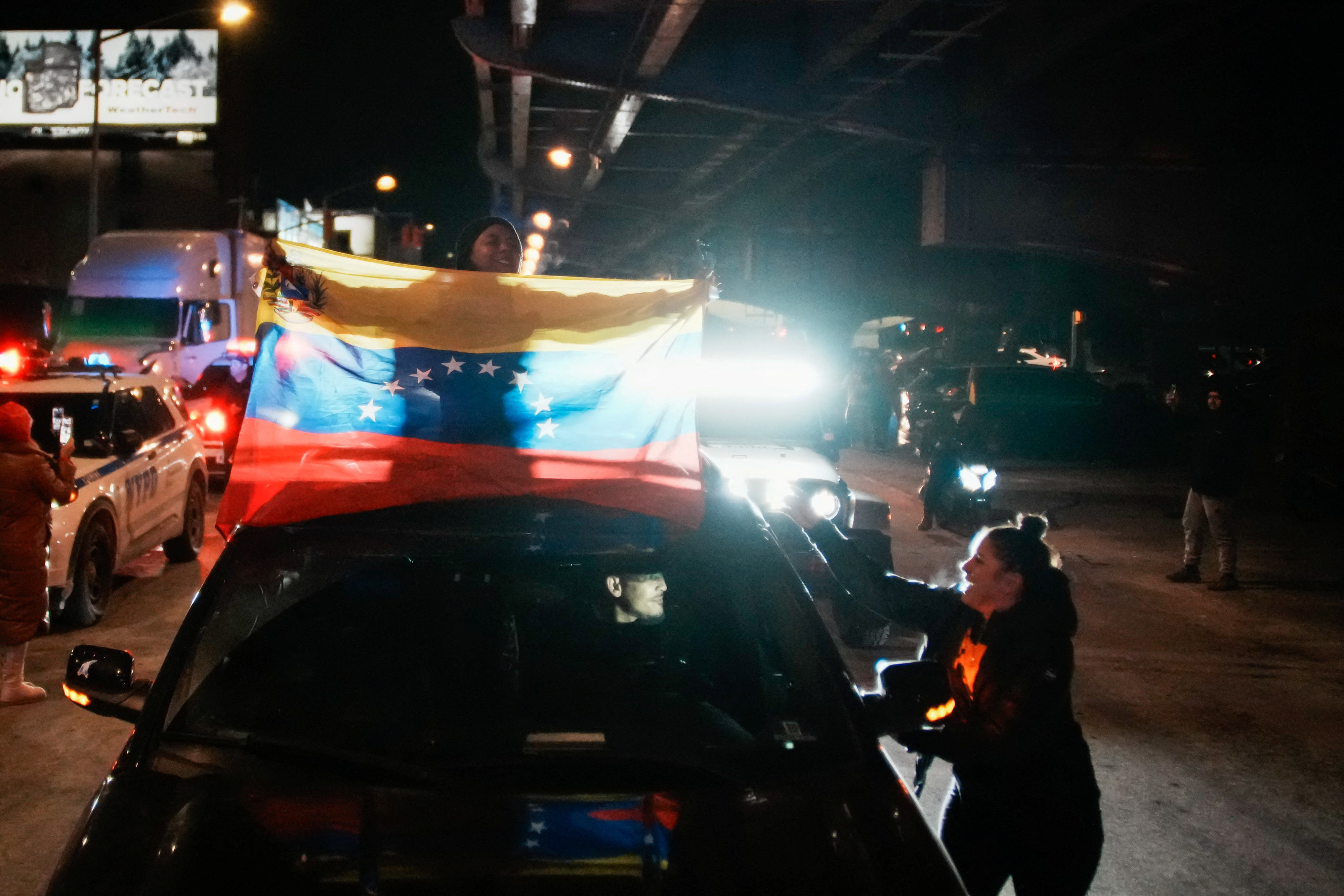 Venezuelan immigrants celebrate outside of the Metropolitan Detention Center in Brooklyn , New York