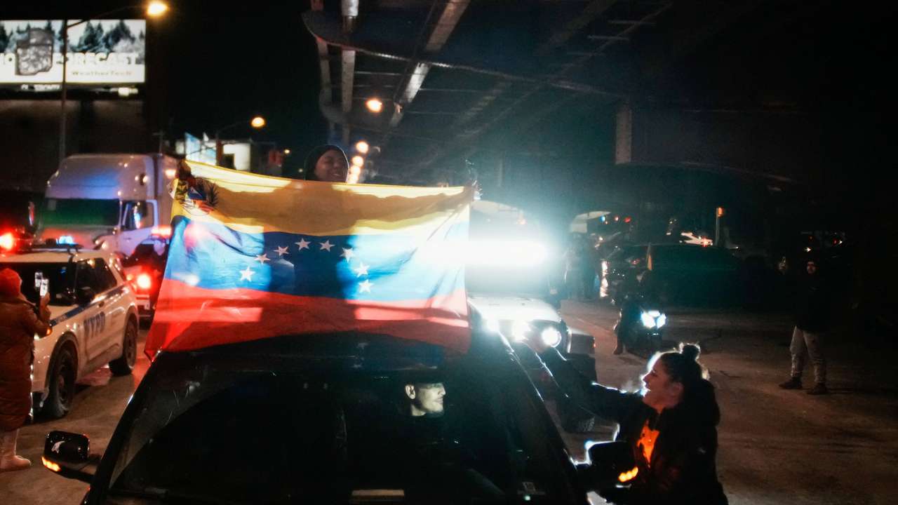 Venezuelan immigrants celebrate outside of the Metropolitan Detention Center in Brooklyn , New York