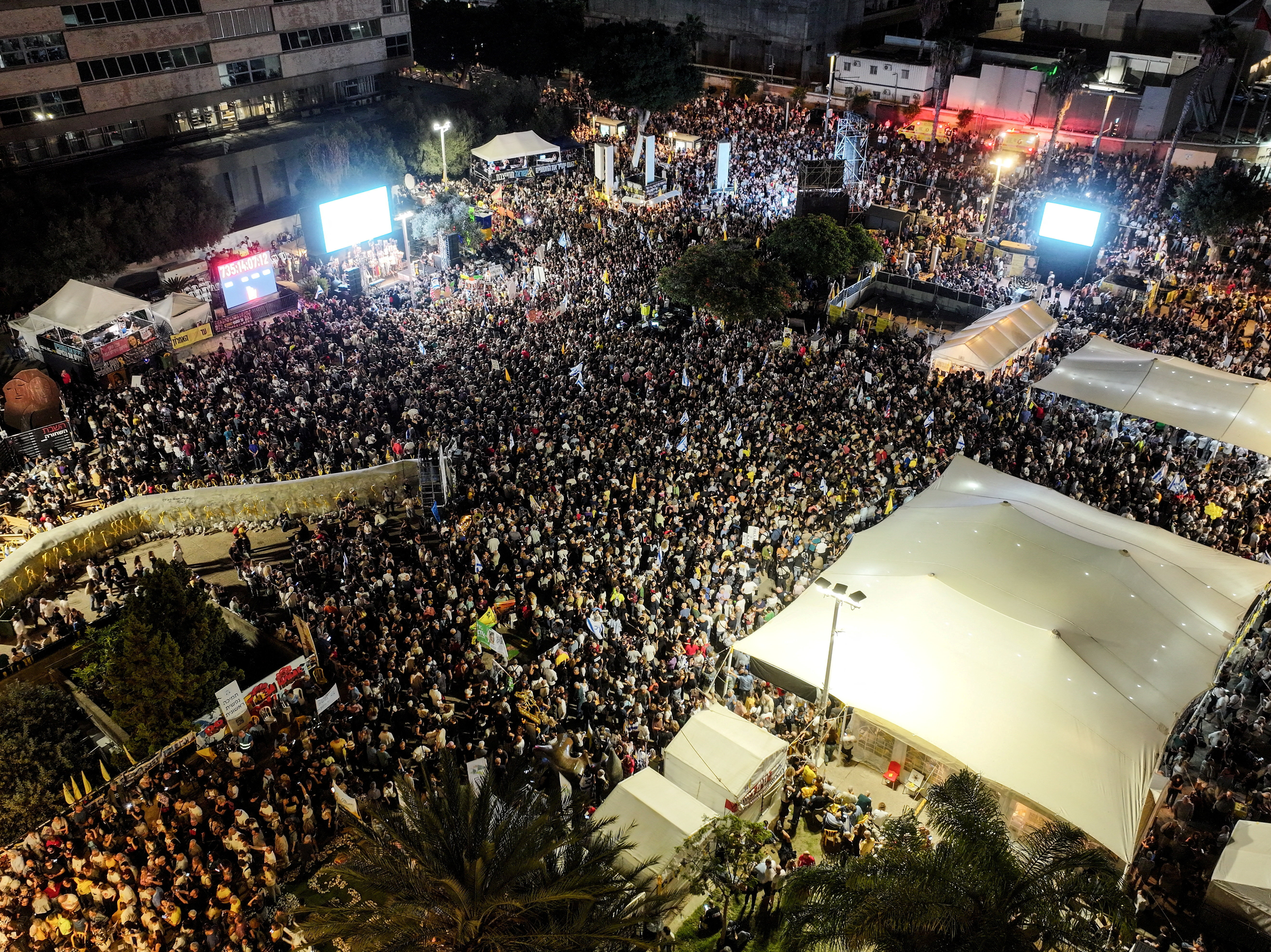 A drone photo of people gathering in "Hostages square", after a ceasefire between Israel and Hamas in Gaza went into effect, in Tel Aviv