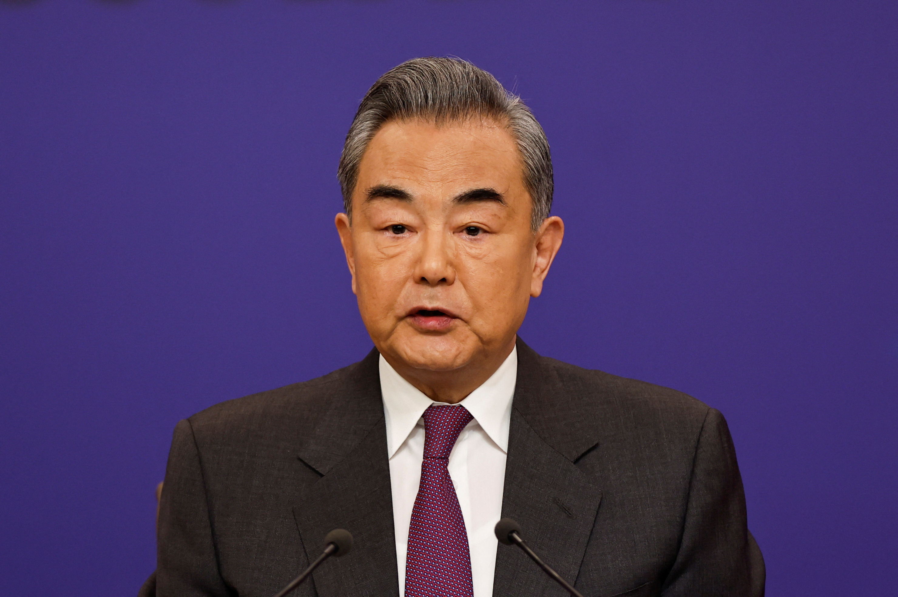 Chinese Foreign Minister Wang Yi attends a press conference on the sidelines of the NPC, in Beijing