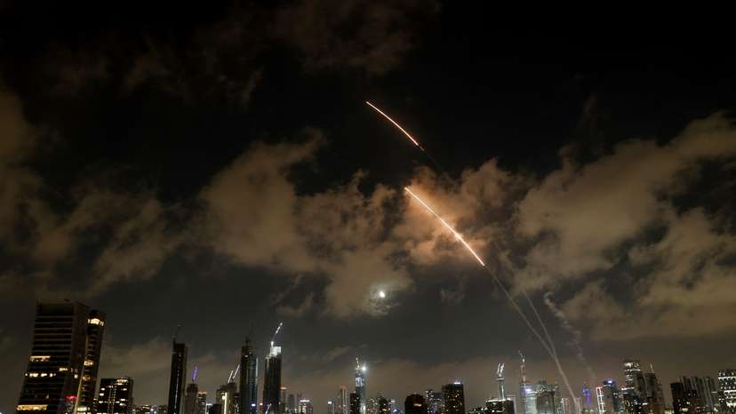 An anti-missile system operates as missiles are launched from Iran, as seen from Tel Aviv