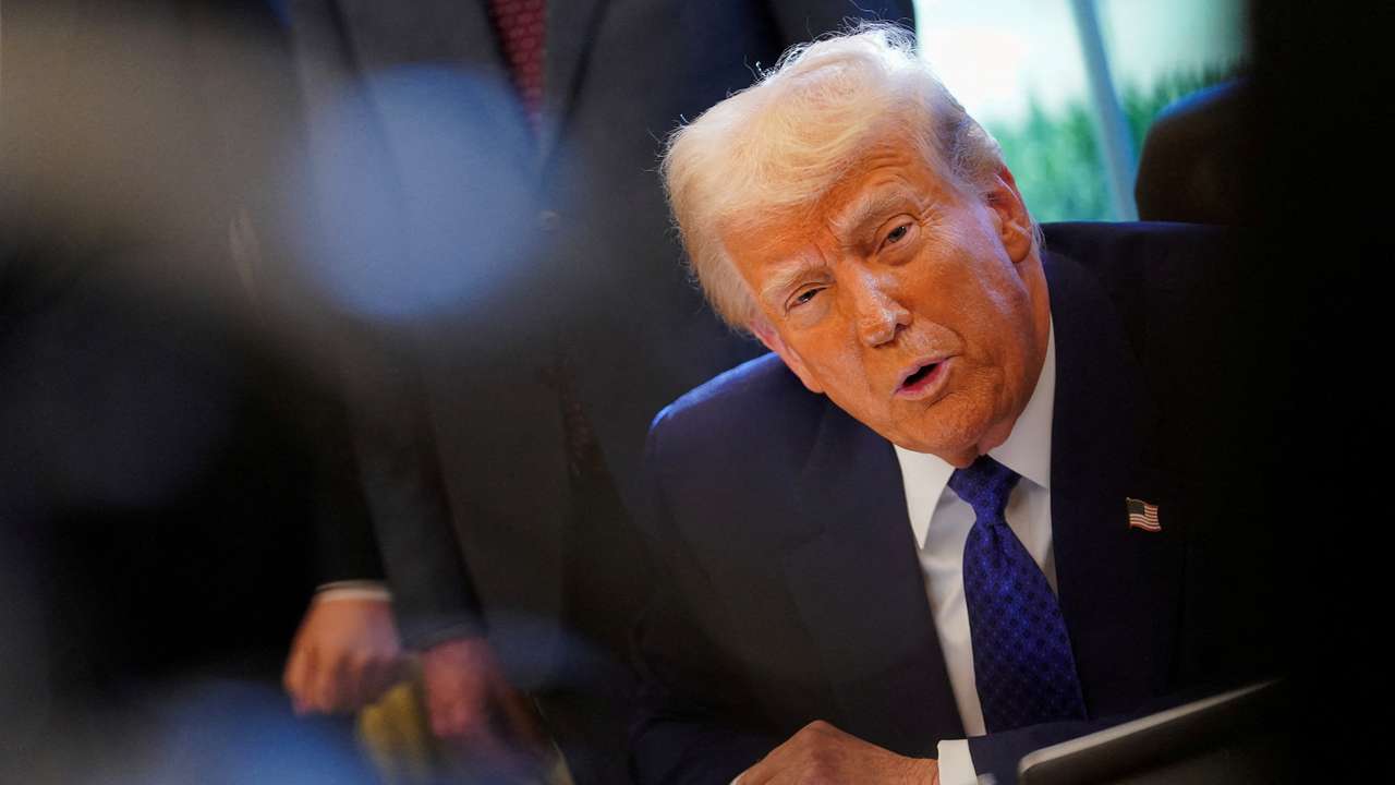 FILE PHOTO: U.S. President Donald Trump signs an executive order in the Oval Office at the White House in Washington, D.C.