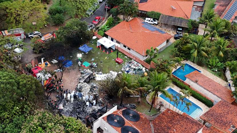 FILE PHOTO: FILE PHOTO: Officials work at the site of a plane crash in Vinhedo, Sao Paulo