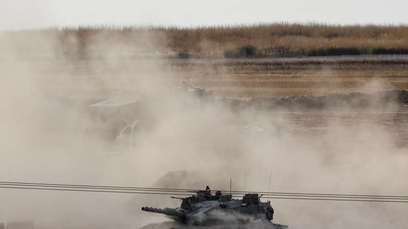 An Israeli tank manoeuvres in Gaza