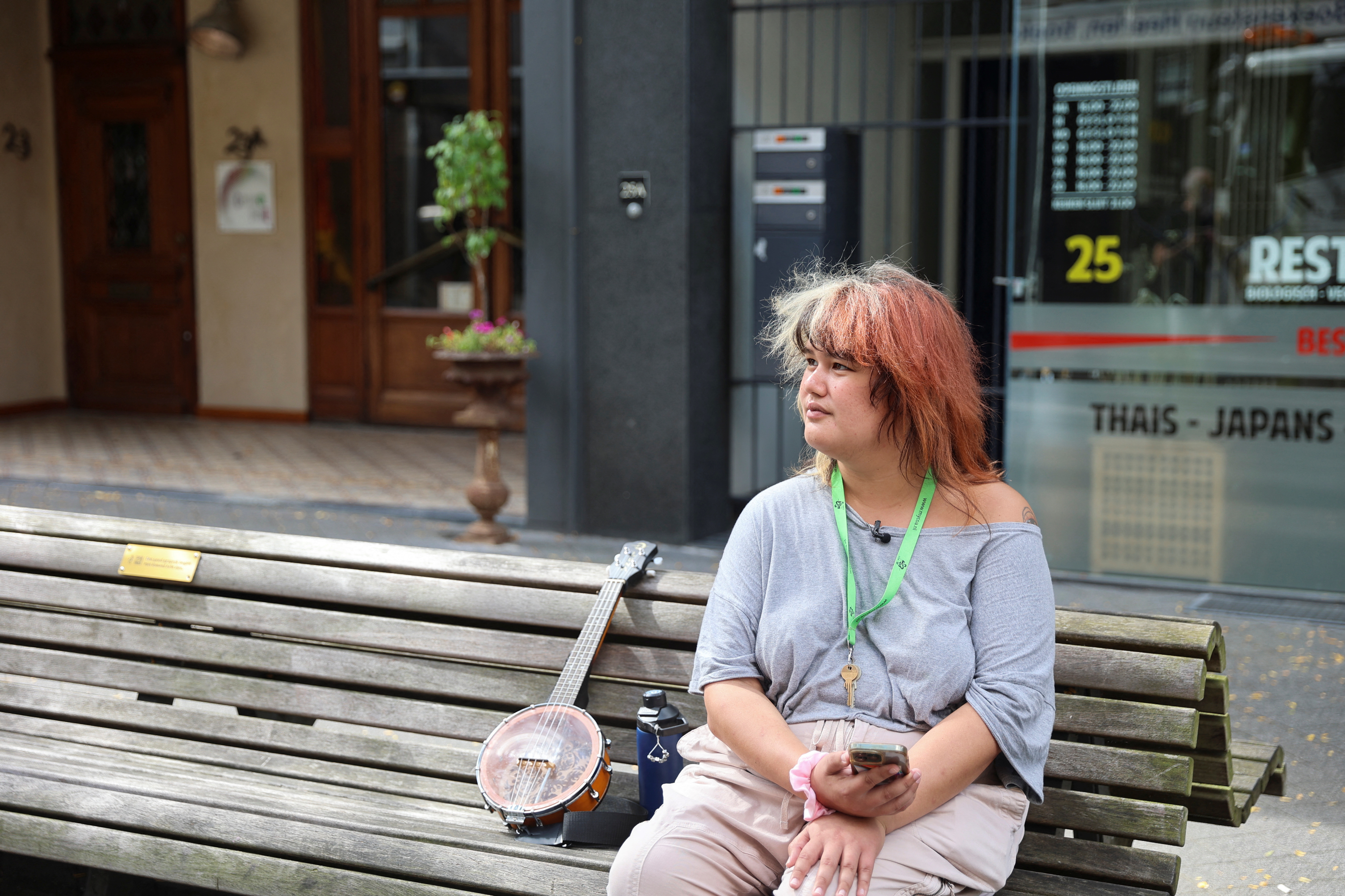 Veronica Clifford Carlos, a U.S. trans woman seeking asylum in the Netherlands, sits on a bench in Heerlen
